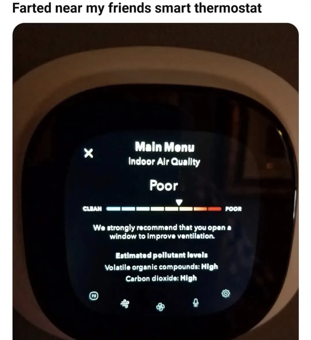 A close-up of a smart thermostat screen displaying 'Main Menu Indoor Air Quality' with a 'Poor' rating on a color-coded bar…
