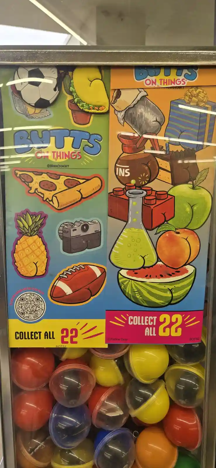 A vending machine display for 'Butts on Things' collectible toys, showing cartoon illustrations of various objects like a…
