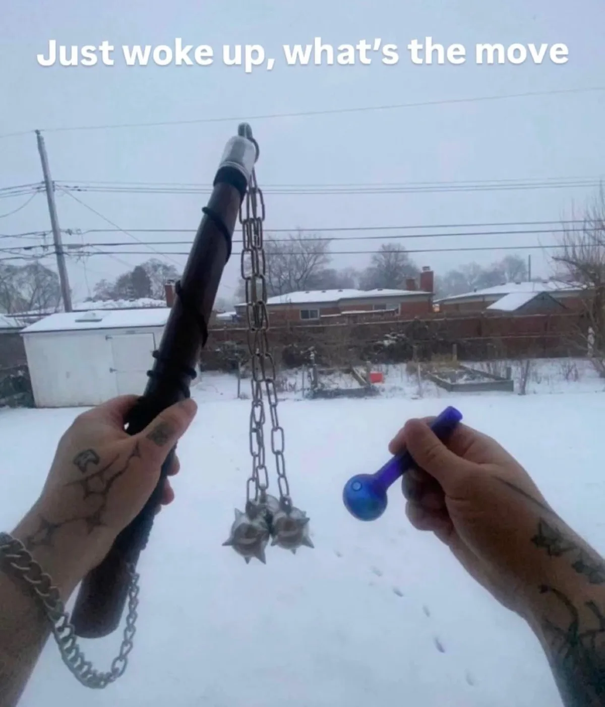A person stands in a snowy backyard holding a nunchaku in one hand and a small blue bong in the other, looking at the…