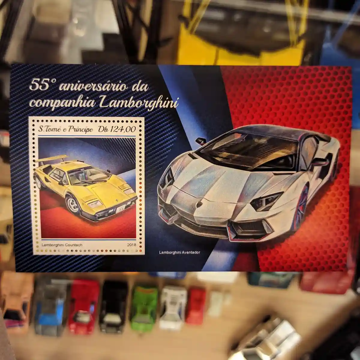 A commemorative stamp sheet from São Tomé and Príncipe celebrating Lamborghini's 55th anniversary, featuring a yellow…