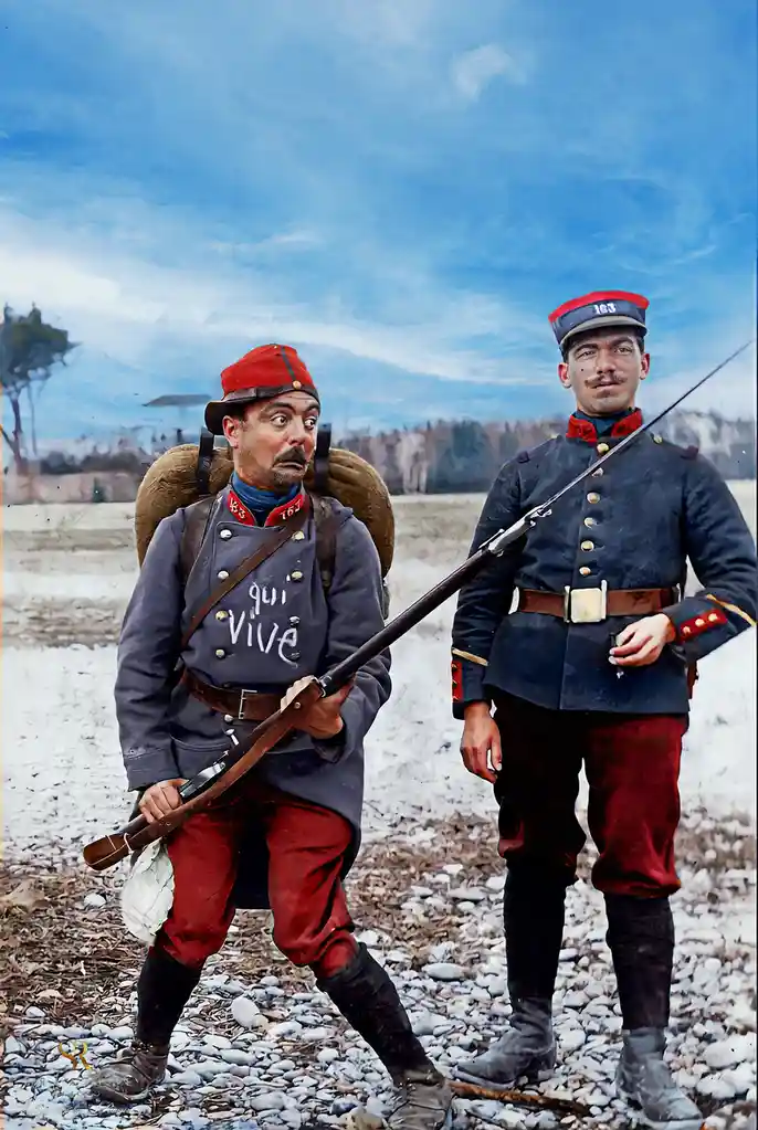 Two soldiers in historical uniforms stand outdoors; the soldier on the left has 'qui vive' written on his chest and a…