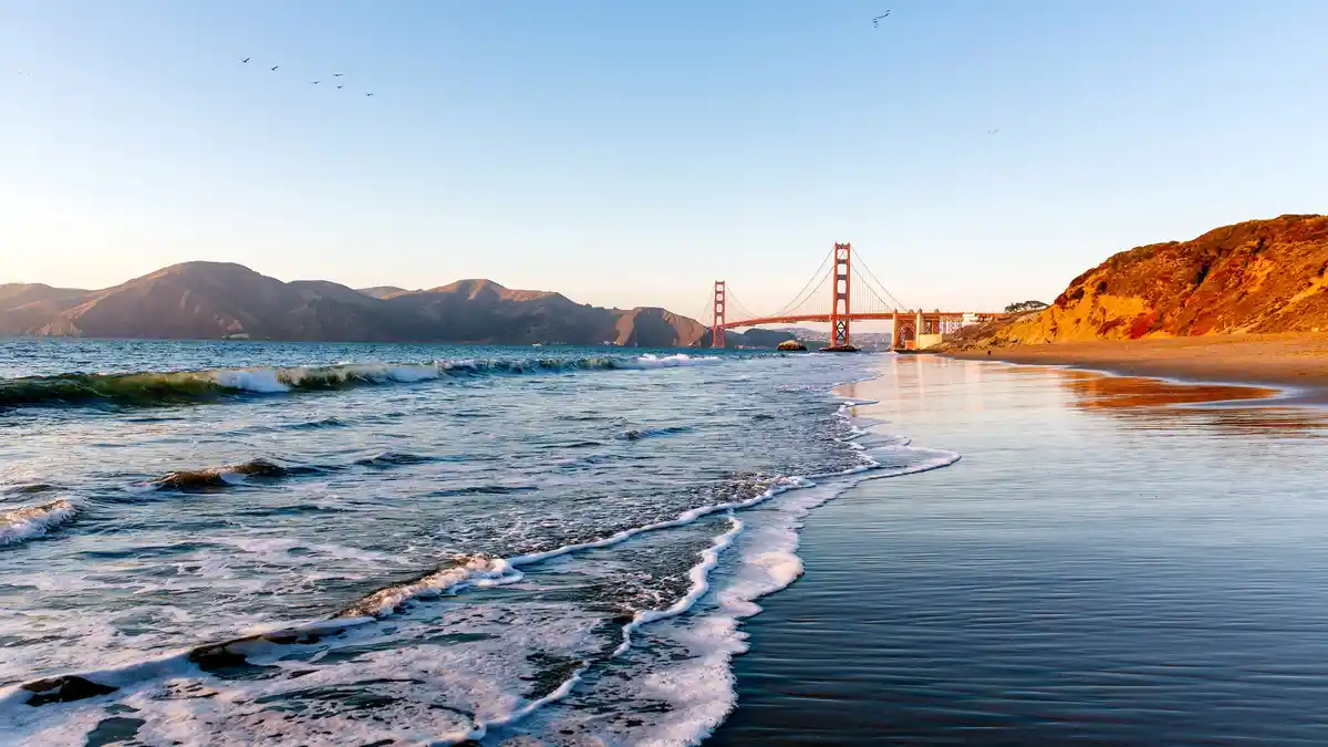 Stroll north on Baker Beach in San Francisco for a quintessential California view. Pacific waves crash against the shore…