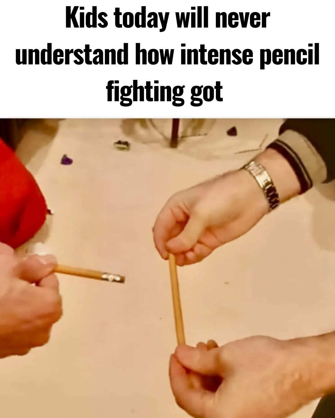 Two hands are shown gripping pencils in a tense standoff, as if engaged in a serious duel. One hand wears a watch and has a…