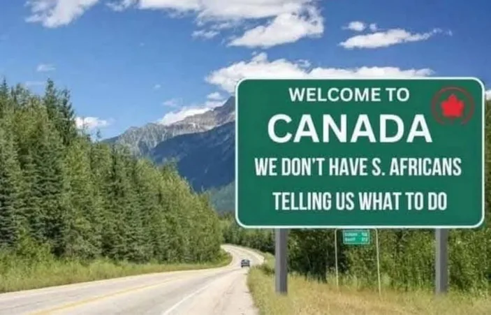 A green Canadian border sign reads 'WELCOME TO CANADA' with a red maple leaf logo, followed by the text 'WE DON'T HAVE S…