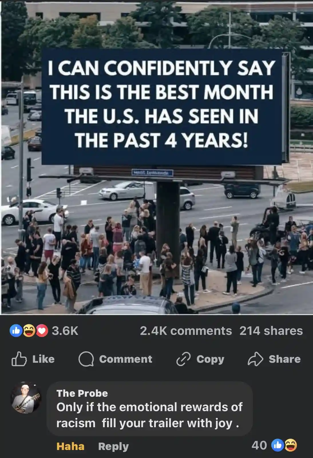 A large billboard displays the text 'I CAN CONFIDENTLY SAY THIS IS THE BEST MONTH THE U.S. HAS SEEN IN THE PAST 4 YEARS!'…