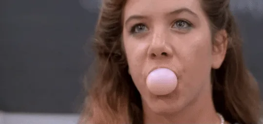 A six-panel image sequence shows a woman blowing a pink bubble gum bubble that grows progressively larger across the first…