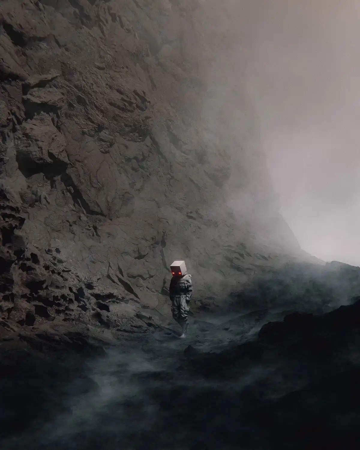 A solitary figure in a grey spacesuit with a glowing red-eyed box head stands alone in a misty, rocky canyon. The overlaid…