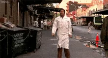 A sequence of six frames shows a woman in a white chef's coat standing on a city street, initially calm, then progressively…