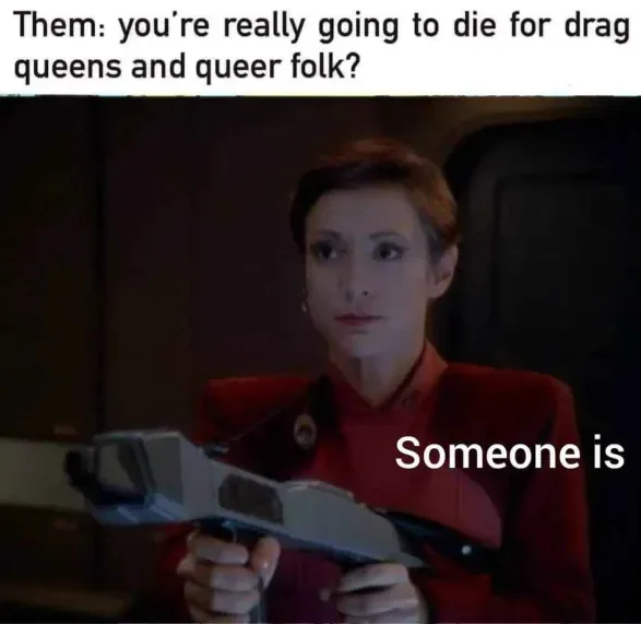 A woman in a red uniform holds a futuristic-looking weapon, looking incredulous. The text above her reads 'Them: you're…