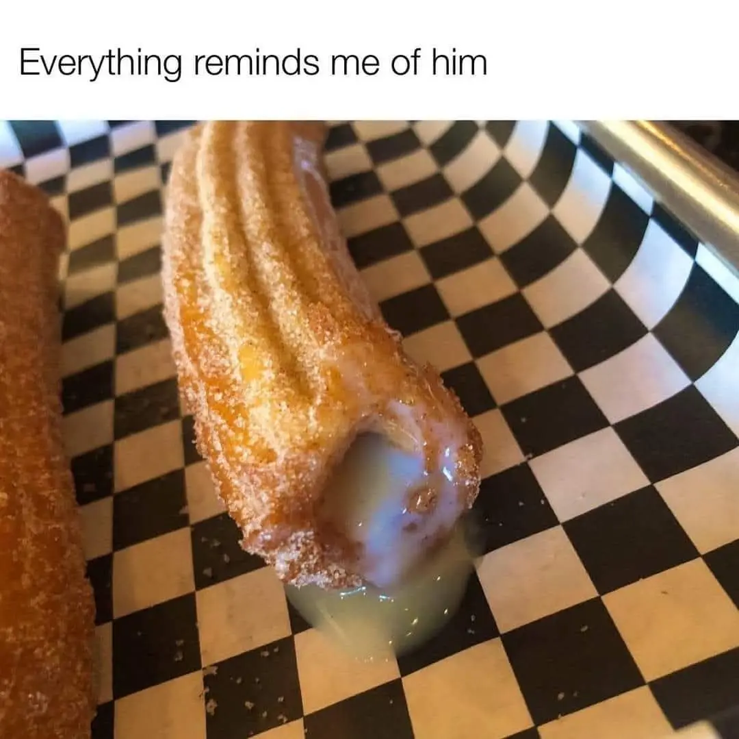 A close-up photo shows a sugared churro with a large hole, dripping creamy white filling onto a black-and-white checkered…