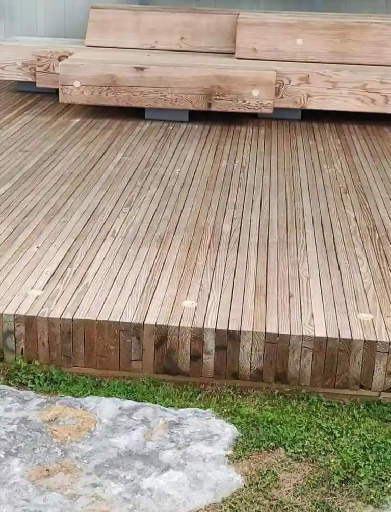 A photo of a wooden deck with a matching bench, showing the wood grain and construction details. The overlaid text reads 'i…