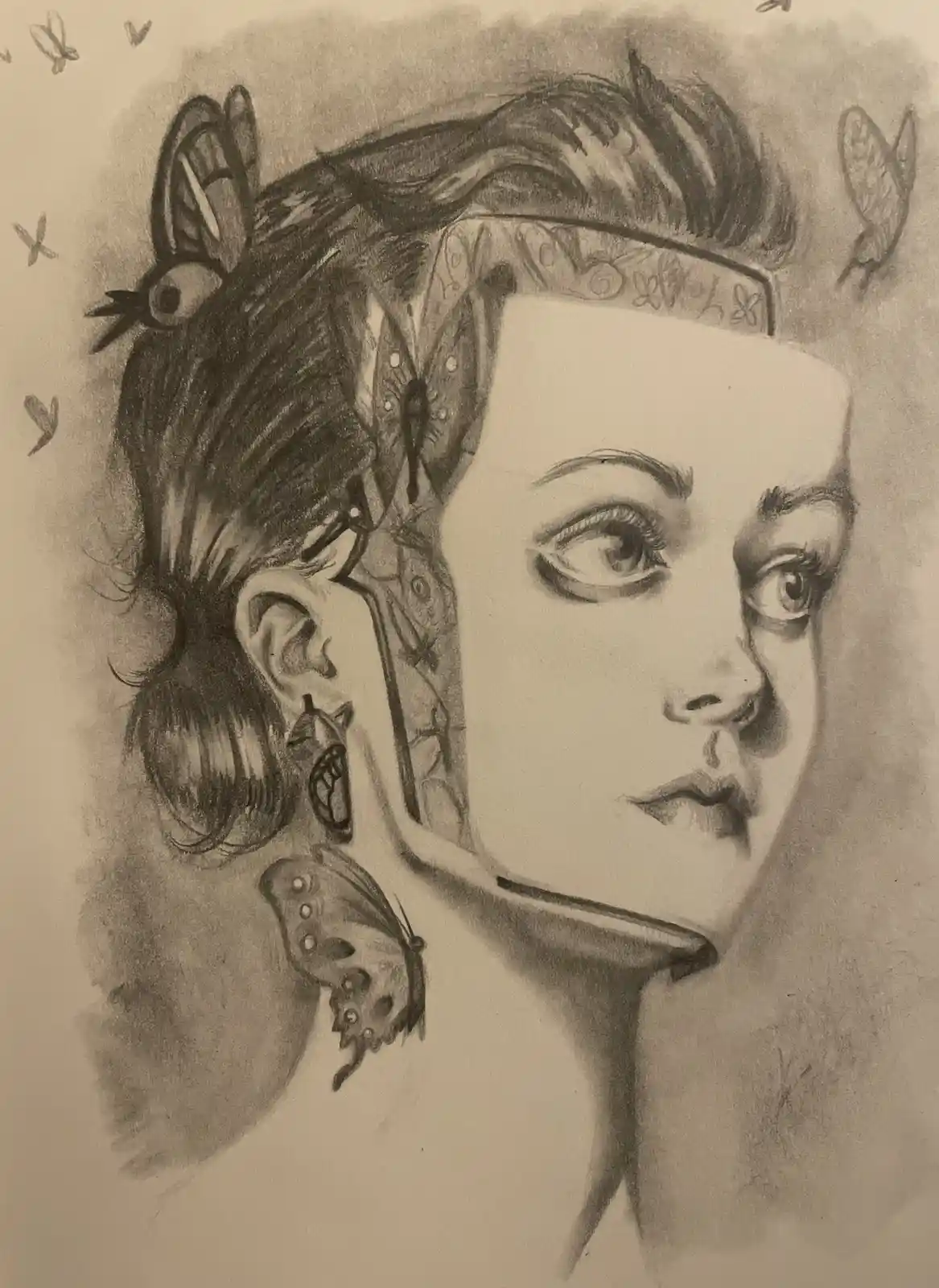 A pencil sketch shows a woman's face split down the middle: one side is a realistic human portrait, the other side is a…