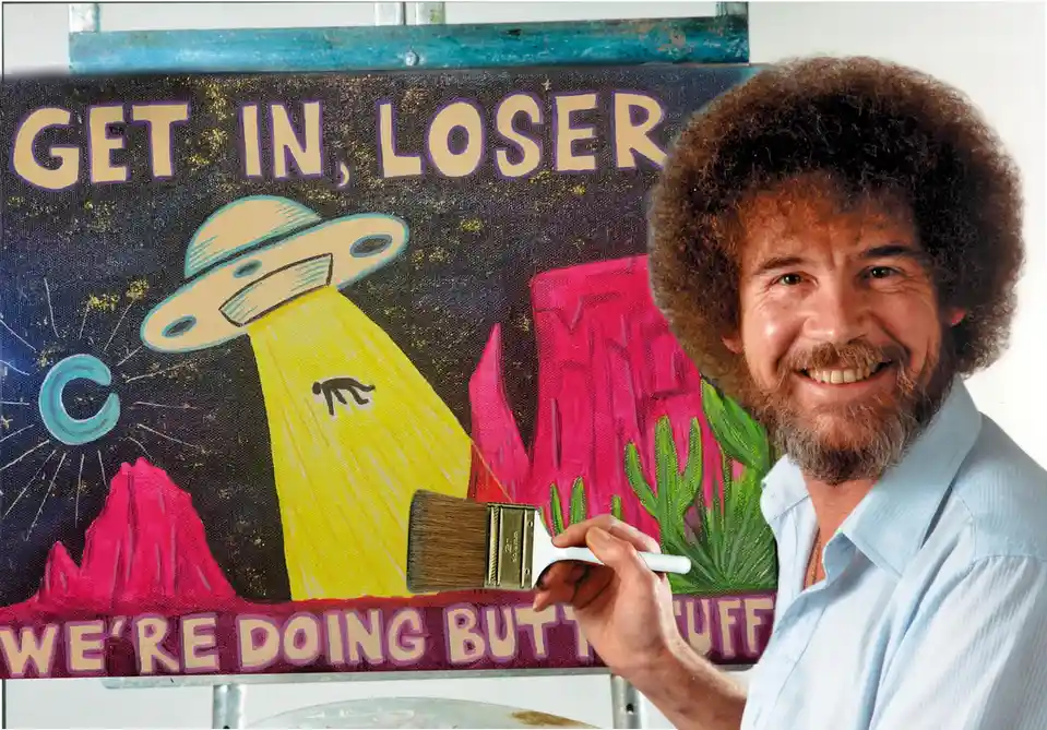 A man with a large afro and beard, holding a paintbrush, stands beside a colorful painting of a UFO abducting a person with…