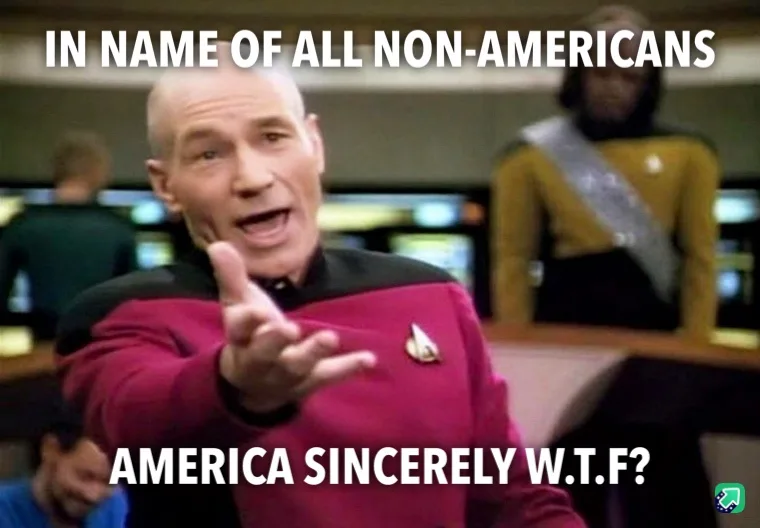 A man in a Starfleet uniform with a red shirt and captain's insignia is gesturing forward with his right hand while…