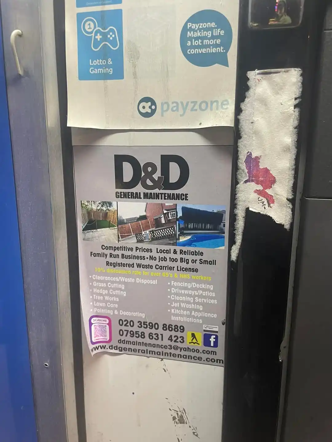A close-up photo shows a torn flyer for 'D&D GENERAL MAINTENANCE' stuck on a public machine, with a Payzone advertisement…
