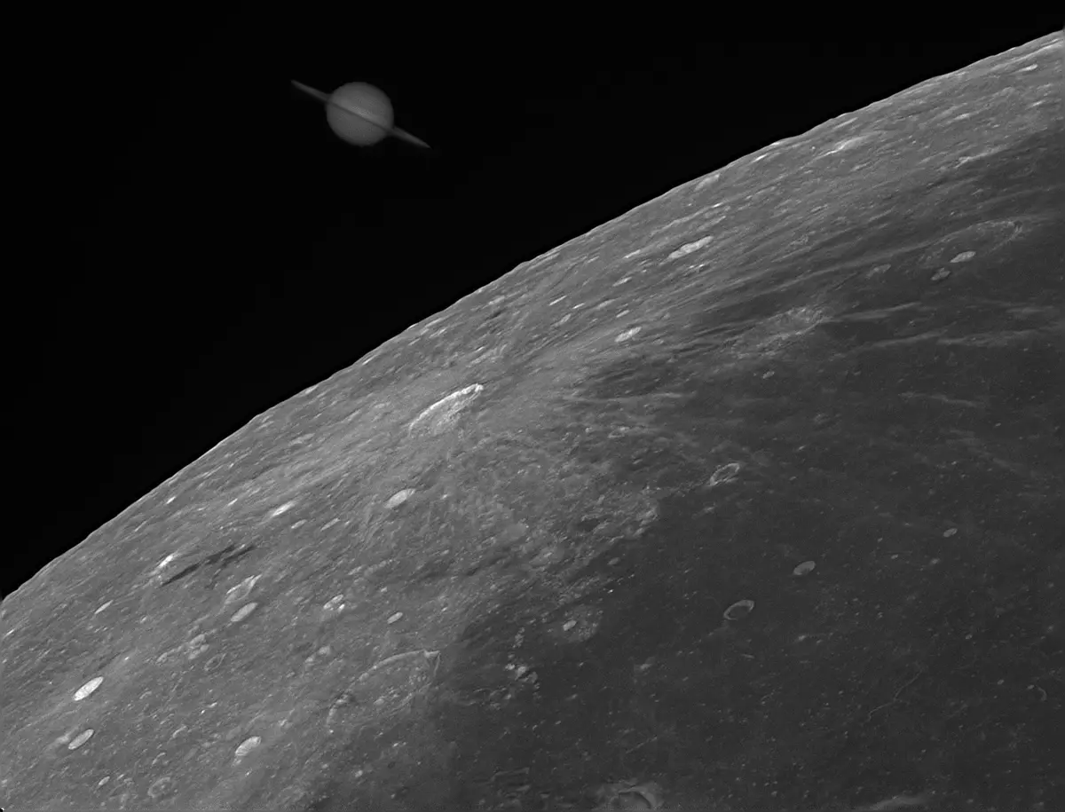 A black-and-white space photograph shows the curved horizon of a cratered, rocky celestial body, likely the Moon, with the…