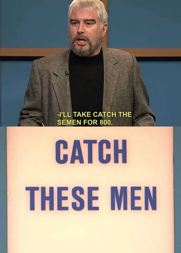 A man with gray hair and a beard, wearing a gray blazer over a black turtleneck, is shown mid-speech in front of a blue…
