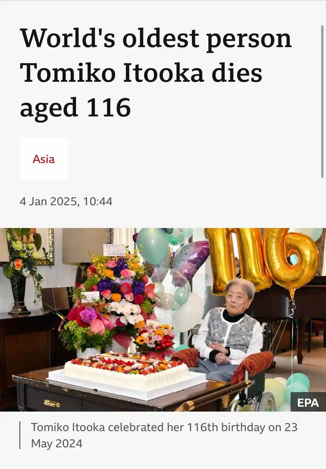 A news article screenshot shows a photo of an elderly woman, Tomiko Itooka, seated in a wheelchair beside a large birthday…