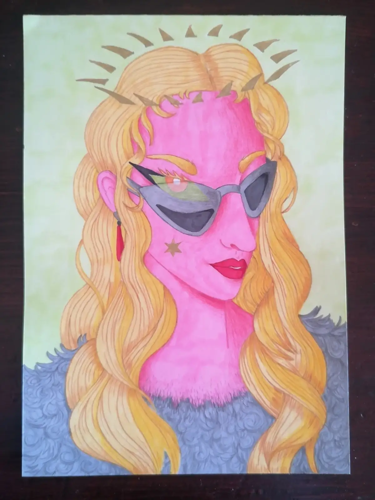 A hand-drawn illustration shows a woman with pink skin, long blonde hair, and a halo of brown triangles above her head. She…
