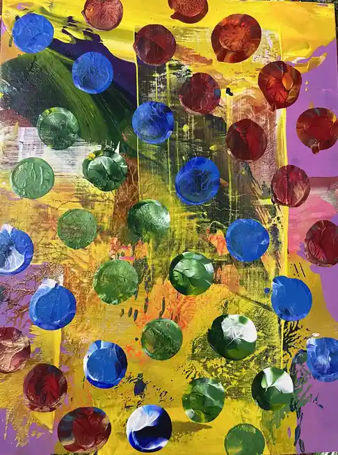 A colorful abstract painting features numerous circular, glossy shapes resembling painted bottle caps or marbles scattered…